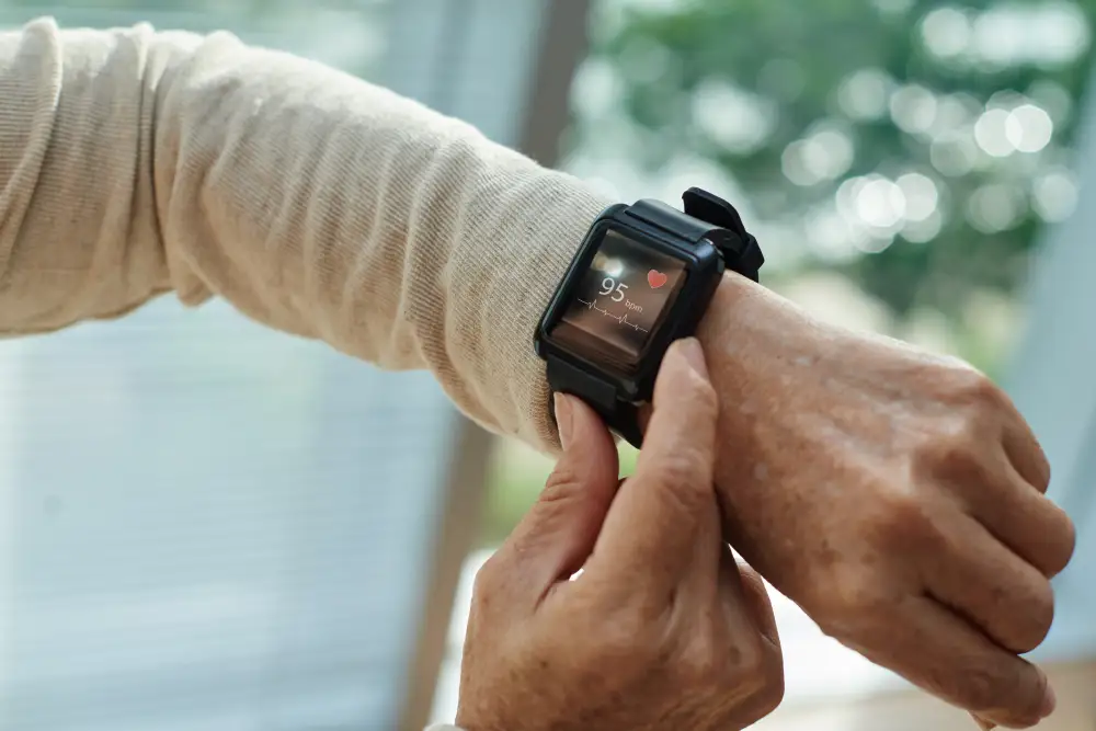 close up of a senior checking their heartrate on their smartwatch