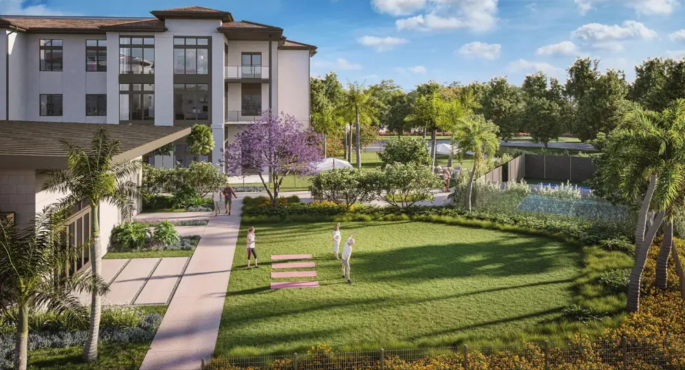 A group of seniors doing yoga outside at The Winsberg at Green Cay