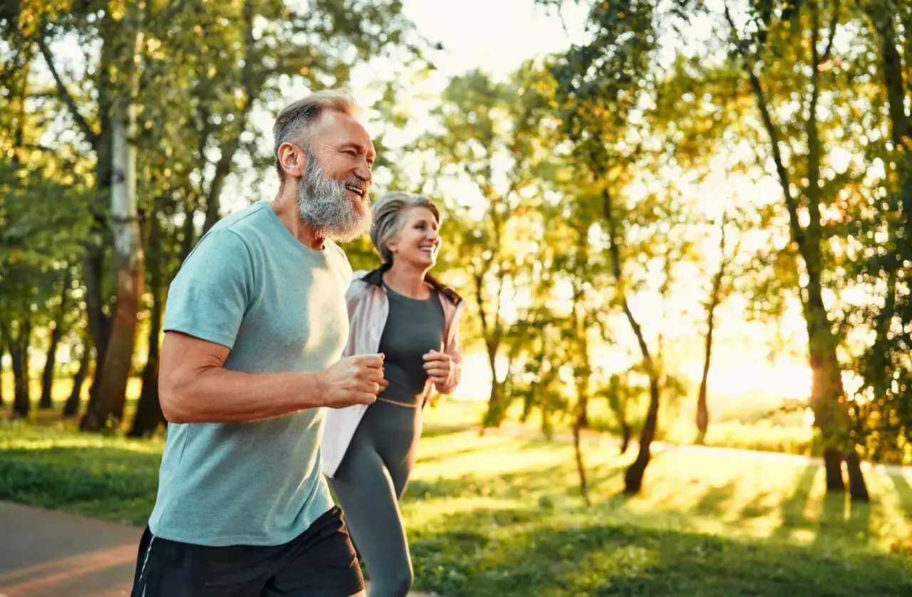 An active senior couple running as an active and modern retirement living lifestyle at The Winsberg at Green Cay in Delray Beach, FL.